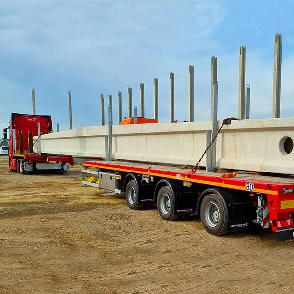 ¿Cómo reducen los semirremolques de transporte de viga estándar los riesgos del transporte de carga de gran tamaño y los costos operativos de la flota?
